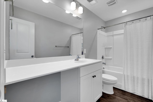 full bathroom featuring vanity, toilet, shower / bath combo with shower curtain, and wood-type flooring