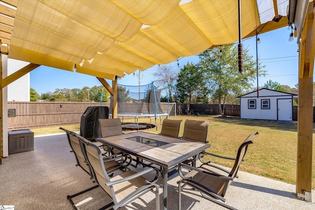 view of patio / terrace featuring a storage unit and a trampoline