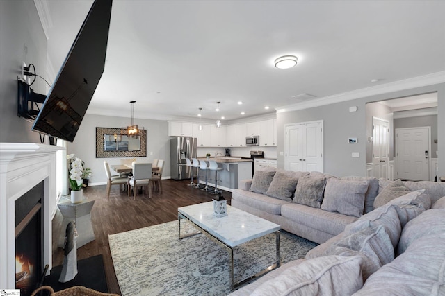 living room featuring crown molding and dark hardwood / wood-style floors