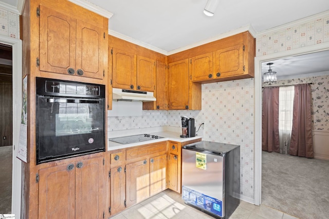 kitchen with black appliances, a chandelier, light colored carpet, and ornamental molding