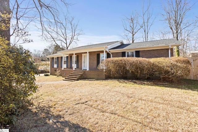 ranch-style home featuring a front yard and a porch