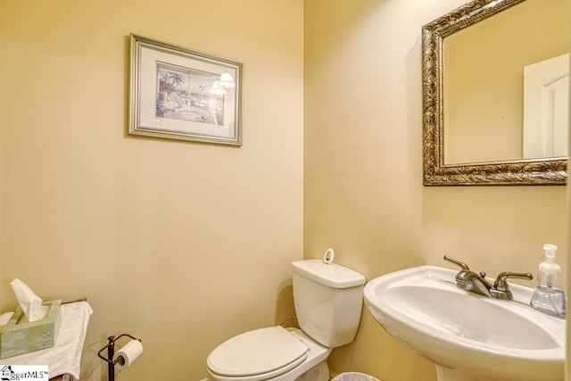 bathroom with sink and toilet