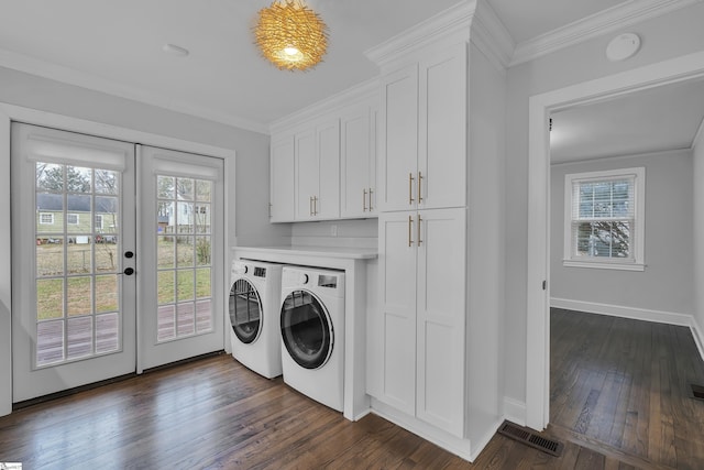 laundry area with plenty of natural light, dark wood-type flooring, washer and clothes dryer, and french doors