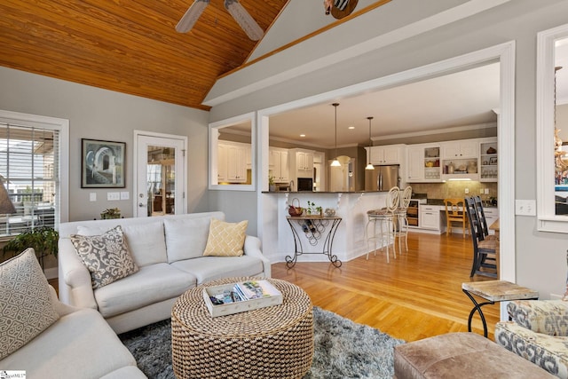 living room featuring ceiling fan, wooden ceiling, lofted ceiling, and light hardwood / wood-style floors