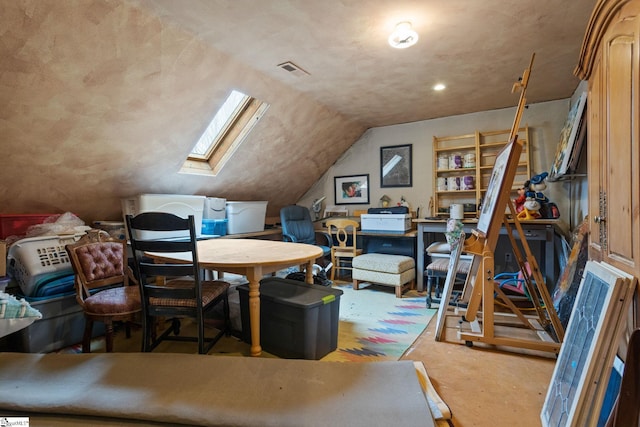 home office featuring vaulted ceiling with skylight