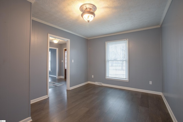 unfurnished room with dark wood-type flooring, a textured ceiling, and ornamental molding