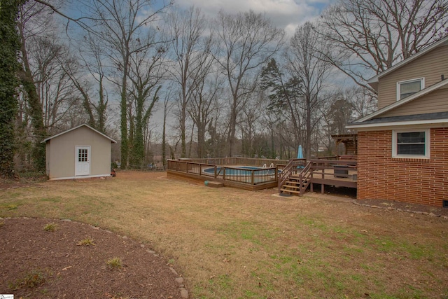 view of yard featuring a swimming pool side deck and a shed