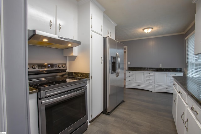 kitchen with white cabinets, appliances with stainless steel finishes, dark stone countertops, dark hardwood / wood-style floors, and crown molding