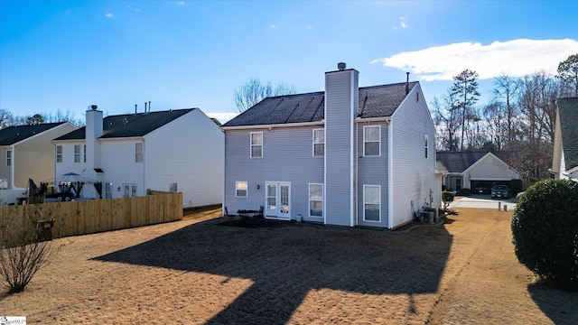 back of house featuring cooling unit