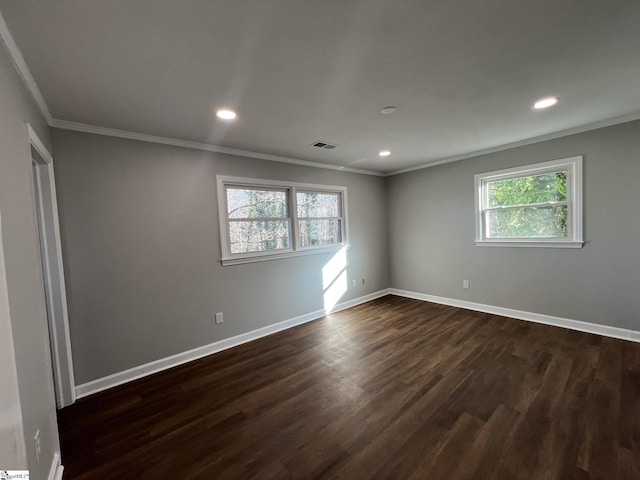 unfurnished room with crown molding and dark hardwood / wood-style flooring