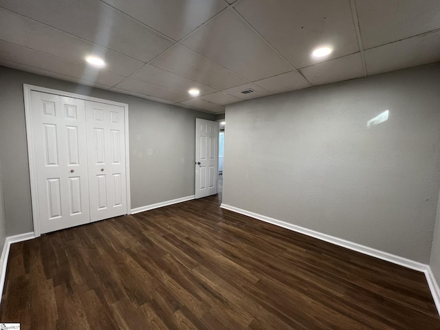 basement featuring dark hardwood / wood-style flooring