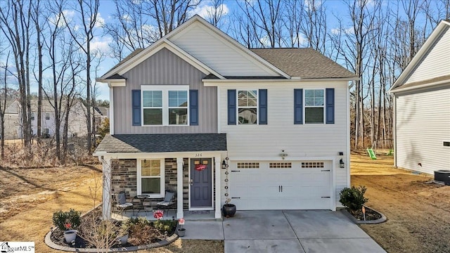 view of front of property featuring a garage and a porch