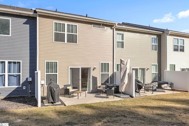 rear view of property with a patio area, a lawn, and cooling unit