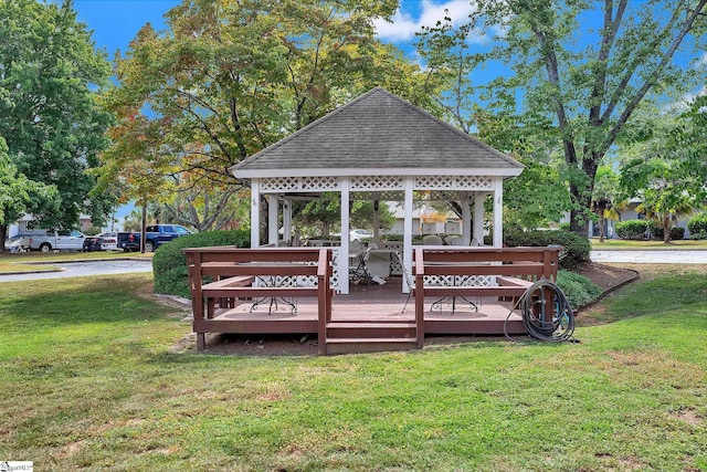 deck with a gazebo and a lawn