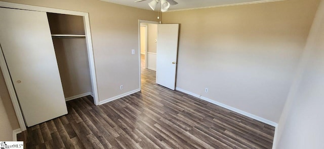 unfurnished bedroom featuring a closet, ceiling fan, and dark hardwood / wood-style floors