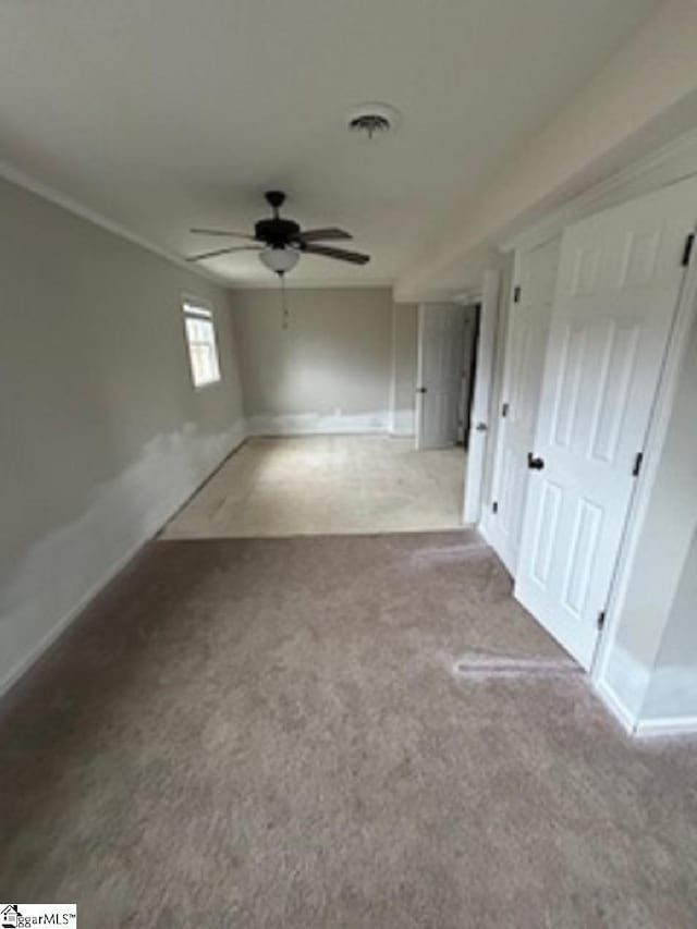 unfurnished room with ceiling fan