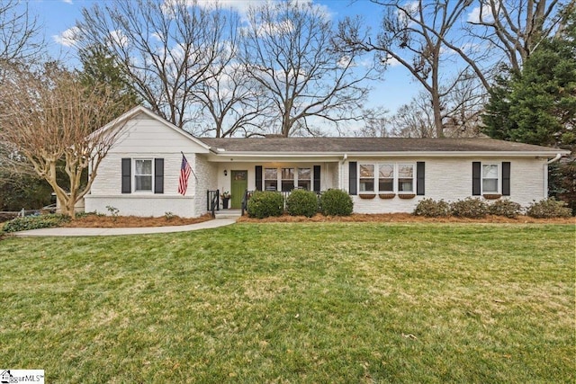 ranch-style home with a front yard