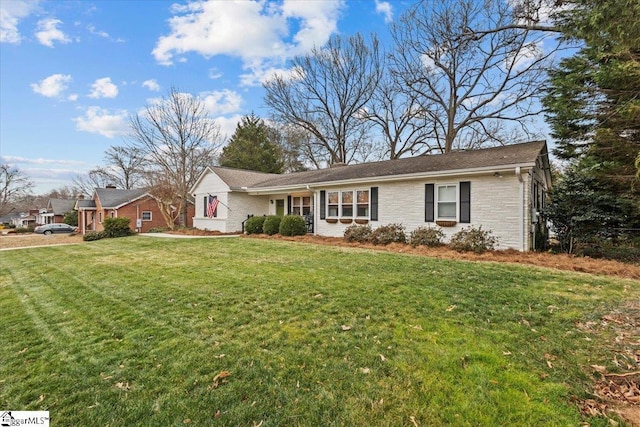 ranch-style house featuring a front lawn