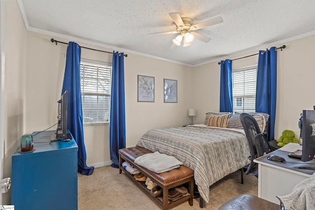 carpeted bedroom with ceiling fan, ornamental molding, and a textured ceiling