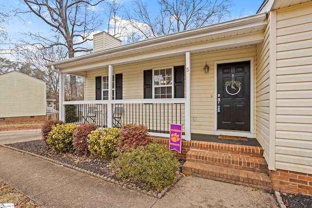 property entrance with covered porch