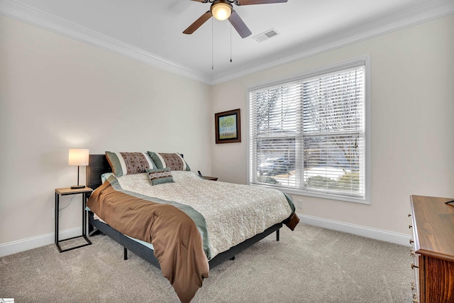 bedroom with ceiling fan, crown molding, and light carpet