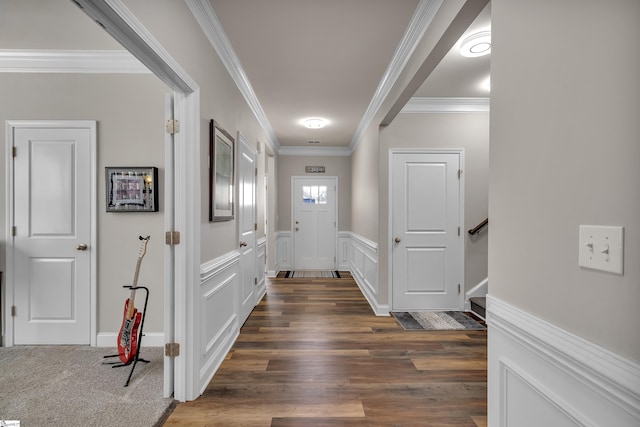 foyer with dark hardwood / wood-style floors and ornamental molding