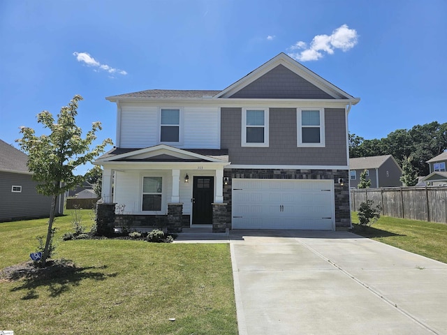 view of front of property with a garage, a front yard, and a porch