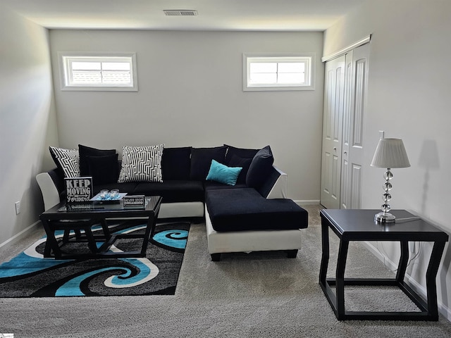 living room with a healthy amount of sunlight and carpet floors