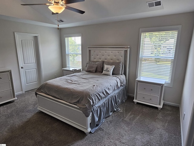 bedroom featuring ceiling fan, dark carpet, and lofted ceiling