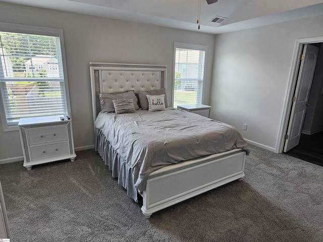 bedroom featuring ceiling fan, dark colored carpet, and vaulted ceiling