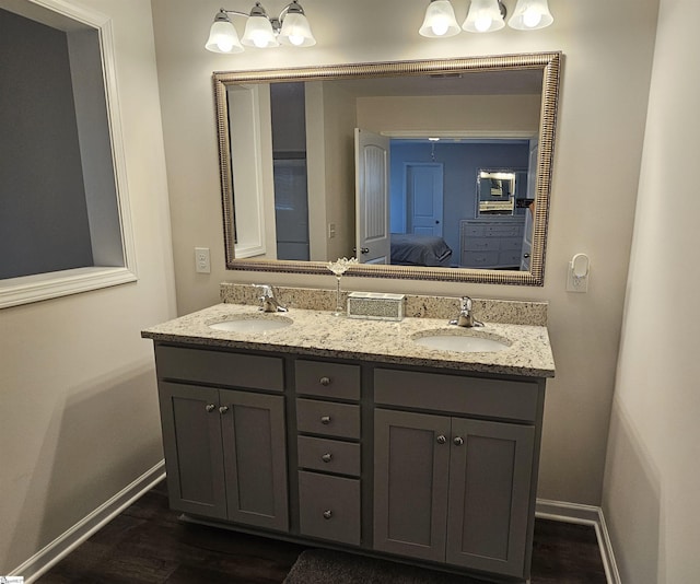 bathroom featuring hardwood / wood-style flooring and vanity