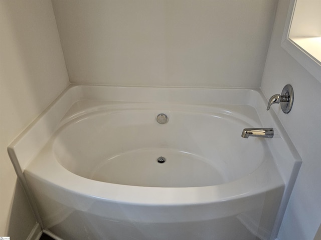 bathroom featuring a tub to relax in