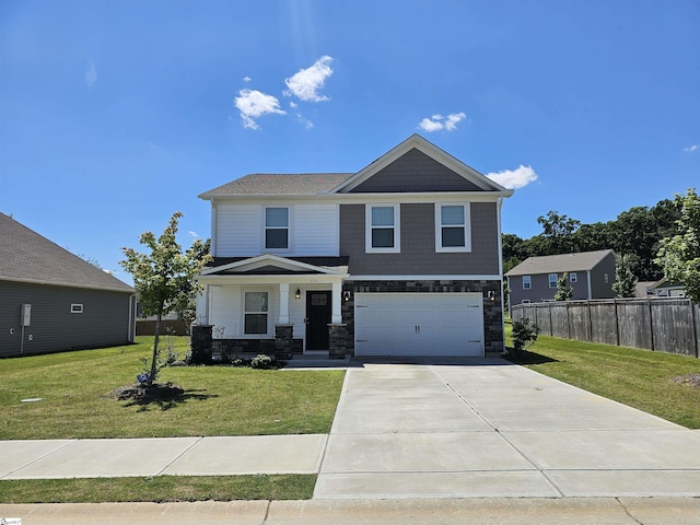 view of front facade with a front yard and a garage