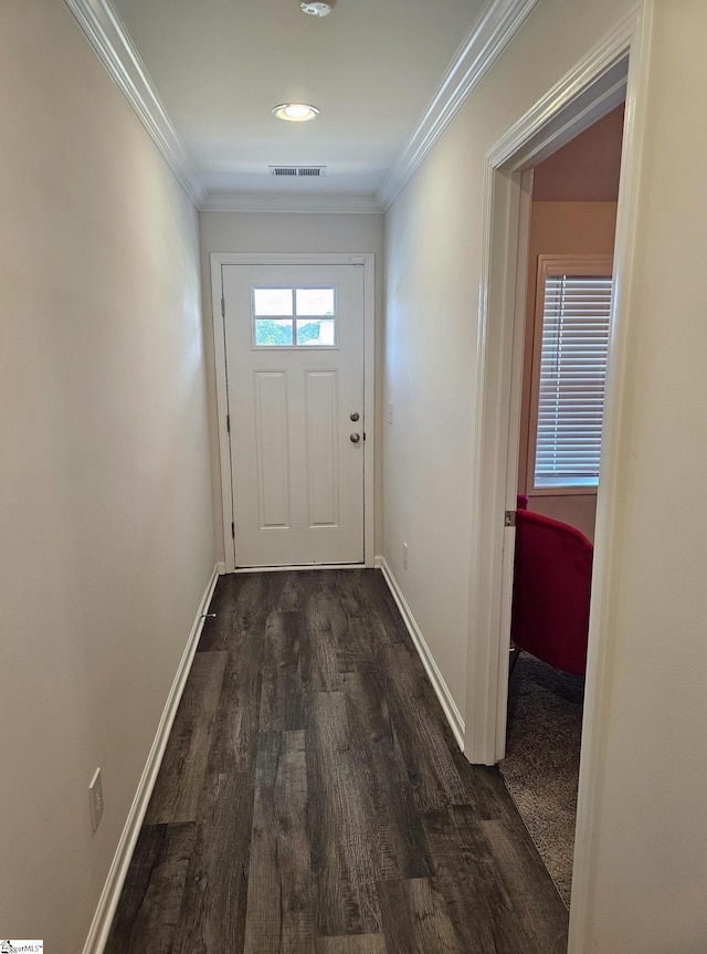 doorway to outside with dark hardwood / wood-style floors and crown molding