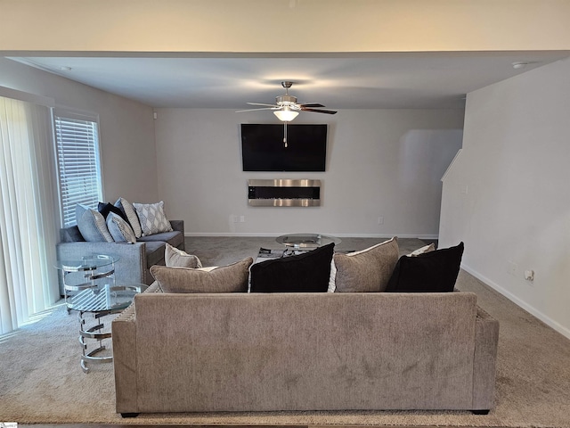 carpeted living room featuring ceiling fan