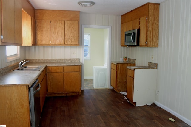 kitchen with sink, dark hardwood / wood-style flooring, and stainless steel appliances