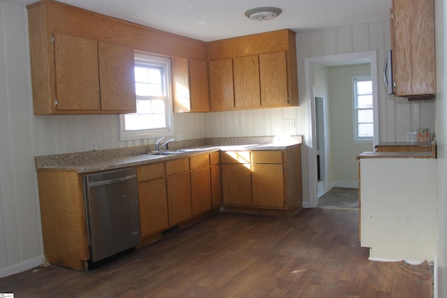 kitchen with sink, dishwasher, and dark hardwood / wood-style flooring