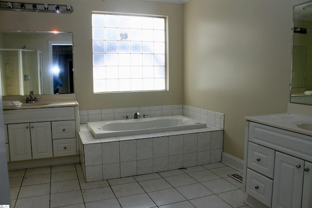 bathroom featuring vanity, shower with separate bathtub, and tile patterned floors