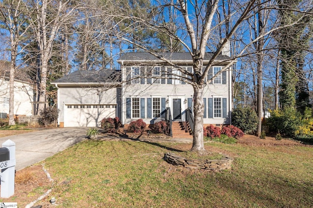 view of front of home featuring a garage and a front lawn