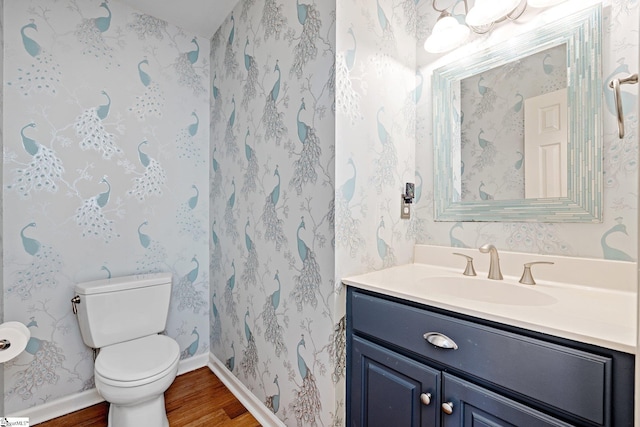 bathroom featuring hardwood / wood-style floors, toilet, and vanity