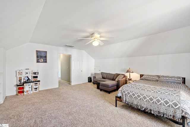 bedroom with ceiling fan, carpet, and lofted ceiling