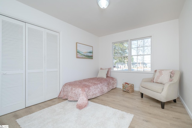 bedroom with a closet and light wood-type flooring