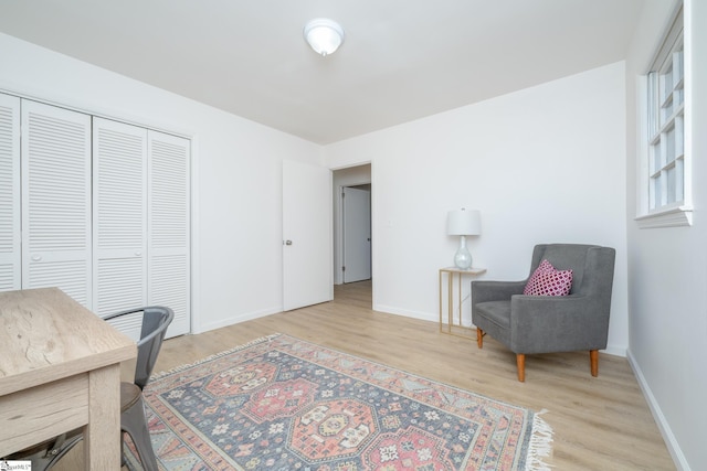 home office with light hardwood / wood-style floors