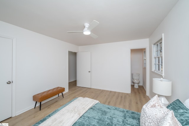 bedroom featuring ceiling fan, connected bathroom, and light hardwood / wood-style flooring