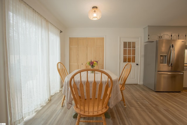 dining area with light hardwood / wood-style flooring