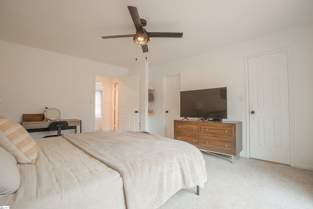 bedroom with ceiling fan and carpet