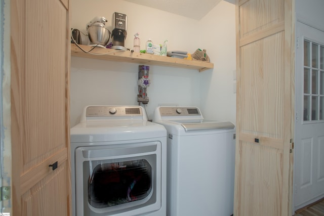 laundry area with independent washer and dryer