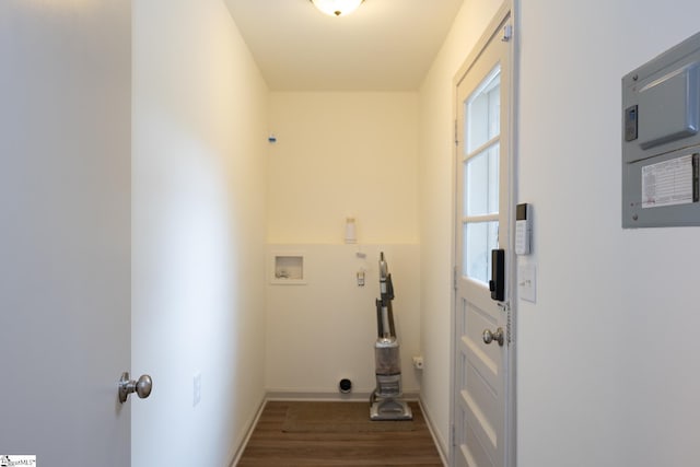 laundry room with dark hardwood / wood-style floors, hookup for a washing machine, and electric panel