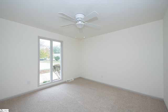 carpeted empty room with ceiling fan