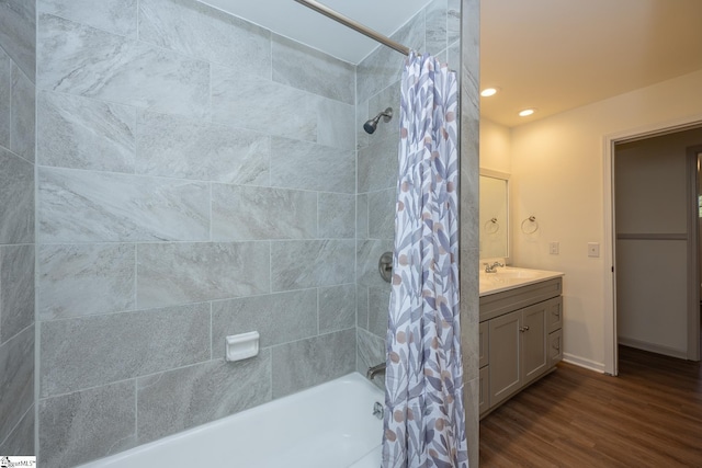 bathroom featuring vanity, hardwood / wood-style floors, and shower / bathtub combination with curtain